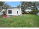 White house exterior with black accents and landscaped yard at 1523 N Beach St, Ormond Beach, FL 32174