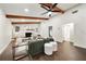 Living room featuring a stone fireplace and wood beams at 1523 N Beach St, Ormond Beach, FL 32174