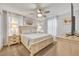 Spacious bedroom with king-size bed and light wood furniture at 1533 Maidstone Ct, Champions Gate, FL 33896