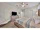 Comfortable bedroom with a queen-size bed and a TV at 1533 Maidstone Ct, Champions Gate, FL 33896