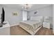 Bright bedroom with a king-size bed and modern decor at 1533 Maidstone Ct, Champions Gate, FL 33896