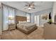 Elegant bedroom featuring a plush bed and ample floor space at 1533 Maidstone Ct, Champions Gate, FL 33896