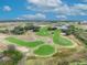 Aerial view of a lush green golf course at 1533 Maidstone Ct, Champions Gate, FL 33896