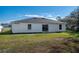 House exterior showcasing a large backyard at 1613 Lansfield Ave, Deltona, FL 32738