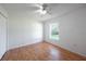 Bedroom with ceiling fan and wood laminate flooring and window at 1613 Lansfield Ave, Deltona, FL 32738