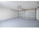 Attached garage with automatic opener and freshly painted floor at 1613 Lansfield Ave, Deltona, FL 32738