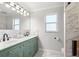 Modern bathroom with double sinks, marble accents, and a walk-in shower at 1706 Tiverton St, Winter Springs, FL 32708