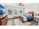 Spacious bedroom with a double bed, large TV, and plenty of natural light at 1706 Tiverton St, Winter Springs, FL 32708