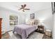 Serene bedroom featuring a plush bed, large window, and wood-look floors at 1706 Tiverton St, Winter Springs, FL 32708