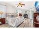 Main bedroom with wood floors and access to backyard at 1706 Tiverton St, Winter Springs, FL 32708