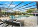 Relaxing pool and patio area with lounge chairs and a screened enclosure at 1706 Tiverton St, Winter Springs, FL 32708