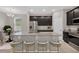 Kitchen island with granite countertops and dark brown cabinets at 1720 Columbus Path, St Cloud, FL 34771