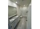 Bathroom with double vanity and bathtub at 1794 Hackberry St, Clermont, FL 34715