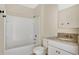 Bathroom with granite countertop sink and bathtub at 1794 Hackberry St, Clermont, FL 34715