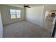 Large bedroom with carpeted floors and a window with a view at 1794 Hackberry St, Clermont, FL 34715