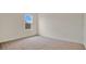 Bright bedroom with carpet flooring and large window at 1794 Hackberry St, Clermont, FL 34715