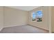 Bright bedroom with carpeted floor and large window at 1794 Hackberry St, Clermont, FL 34715