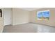 Bright bedroom with tile floors and large window with a view at 1794 Hackberry St, Clermont, FL 34715