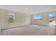 Spacious bonus room with carpet and multiple windows at 1794 Hackberry St, Clermont, FL 34715