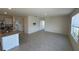 Open-concept living room with tile floors and kitchen island at 1794 Hackberry St, Clermont, FL 34715