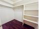 Large walk-in closet with shelves and hanging rod at 1854 Sepalwood Ct, Orlando, FL 32818