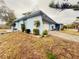 Another side view of the light blue house with garage at 1854 Sepalwood Ct, Orlando, FL 32818