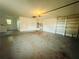 Spacious garage with washer, dryer, and ample storage shelving at 1854 Sepalwood Ct, Orlando, FL 32818