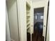 Hallway with built-in shelving and dark hardwood floors at 1854 Sepalwood Ct, Orlando, FL 32818