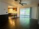 Living room, kitchen, and sliding door to patio at 1854 Sepalwood Ct, Orlando, FL 32818