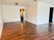 Living room with wood-look floors and access to bathroom at 1854 Sepalwood Ct, Orlando, FL 32818