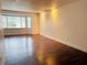 Living room with wood-look floors and a large window at 1854 Sepalwood Ct, Orlando, FL 32818