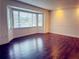 Bright living room with bay window and wood-look floors at 1854 Sepalwood Ct, Orlando, FL 32818