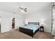 Main bedroom with king-size bed and walk-in closet at 2041 Brillante Dr, St Cloud, FL 34771