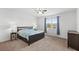 Main bedroom with king-size bed and ample natural light at 2041 Brillante Dr, St Cloud, FL 34771