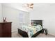 Bedroom with a queen bed and geometric patterned bedding at 2041 Brillante Dr, St Cloud, FL 34771