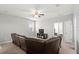 Spacious bonus room with leather sectional sofa and entertainment center at 2041 Brillante Dr, St Cloud, FL 34771