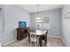 Bright dining room with wood table and chairs near kitchen at 2041 Brillante Dr, St Cloud, FL 34771