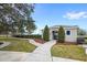 Community pool entrance with landscaping, walkway, and seating at 2041 Brillante Dr, St Cloud, FL 34771