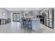 Modern kitchen with gray cabinets and stainless steel appliances at 20493 Majestic St, Orlando, FL 32833