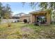 Backyard with patio, grill and grassy area at 2204 Napone Ln, Minneola, FL 34715