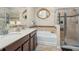 Double vanity bathroom with soaking tub and walk-in shower at 2204 Napone Ln, Minneola, FL 34715