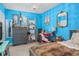 Charming bedroom with blue walls and stylish furnishings at 2204 Napone Ln, Minneola, FL 34715