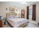 Spacious bedroom with a large bed and plenty of closet space at 2204 Napone Ln, Minneola, FL 34715