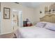 Bright bedroom with ensuite bathroom access and ample natural light at 2204 Napone Ln, Minneola, FL 34715