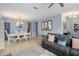 Dining room with white table, chairs, and a chandelier at 2204 Napone Ln, Minneola, FL 34715