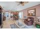 Living room with comfortable seating and view to kitchen at 2204 Napone Ln, Minneola, FL 34715