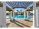 View of the pool through a pergola at 2546 Renshaw St, Kissimmee, FL 34747