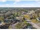 Aerial view showing home's location in a residential neighborhood with mature trees at 300 S Brighton Dr, Port Orange, FL 32127