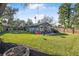 Spacious backyard with grassy lawn and patio at 300 S Brighton Dr, Port Orange, FL 32127