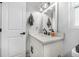 Bathroom features a vanity with quartz countertop and modern fixtures at 300 S Brighton Dr, Port Orange, FL 32127